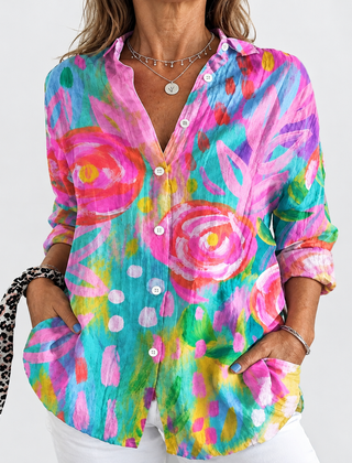 Floral button-up blouse with long sleeves, V-neck; colorful abstract blooms on teal