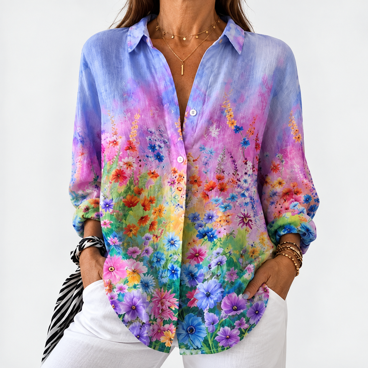 Floral button-up blouse with long sleeves, V-neck; multicolor blooms on blue ground