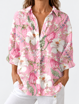 Pink floral V-neck blouse with 3/4 sleeves, button-front top