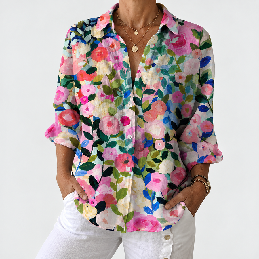 Floral button-up blouse with V-neck and 3/4 sleeves, colorful blossom print