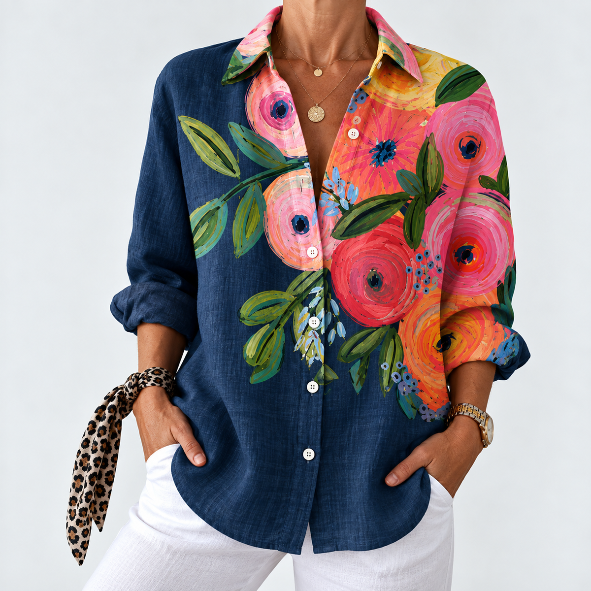 Navy colorblock blouse with button front, colorful floral print sleeves and collar