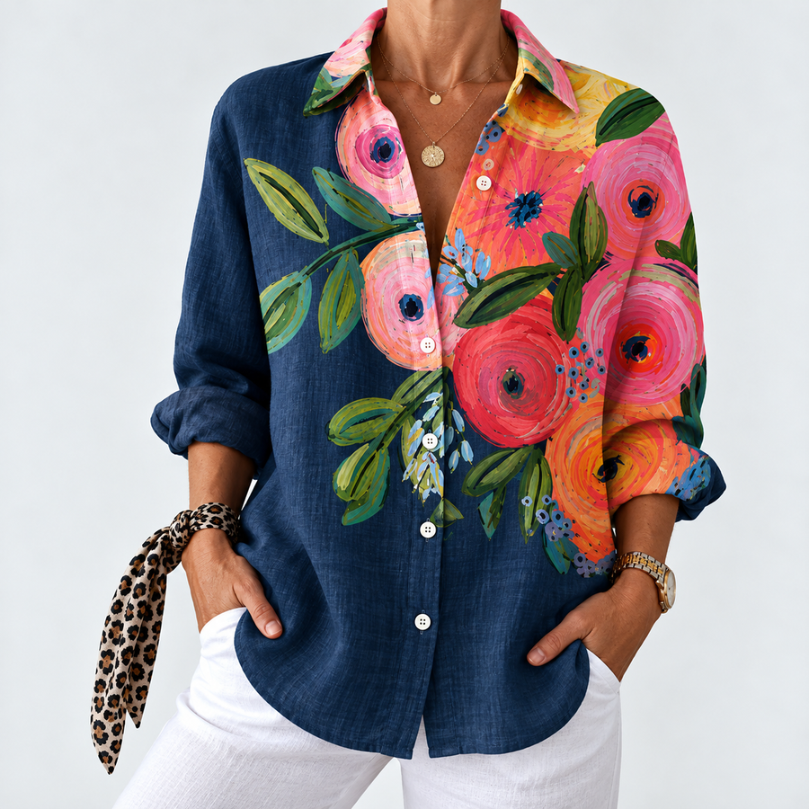 Navy colorblock blouse with button front, colorful floral print sleeves and collar