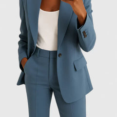 Blue two-piece blazer and trousers set with notched lapels and flap pockets