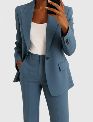 Blue two-piece blazer and trousers set with notched lapels and flap pockets