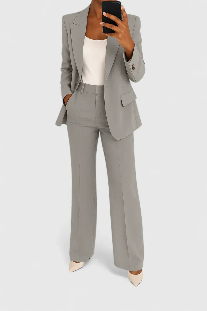 Gray two-piece blazer and trousers set with notched lapels and matching pants