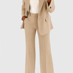 Beige two-piece blazer and trousers set with notched lapels and cuffed hems