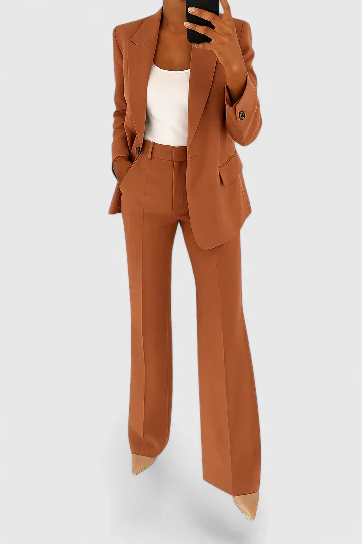 Rust brown two-piece blazer and trousers set with notched lapels and flap pockets