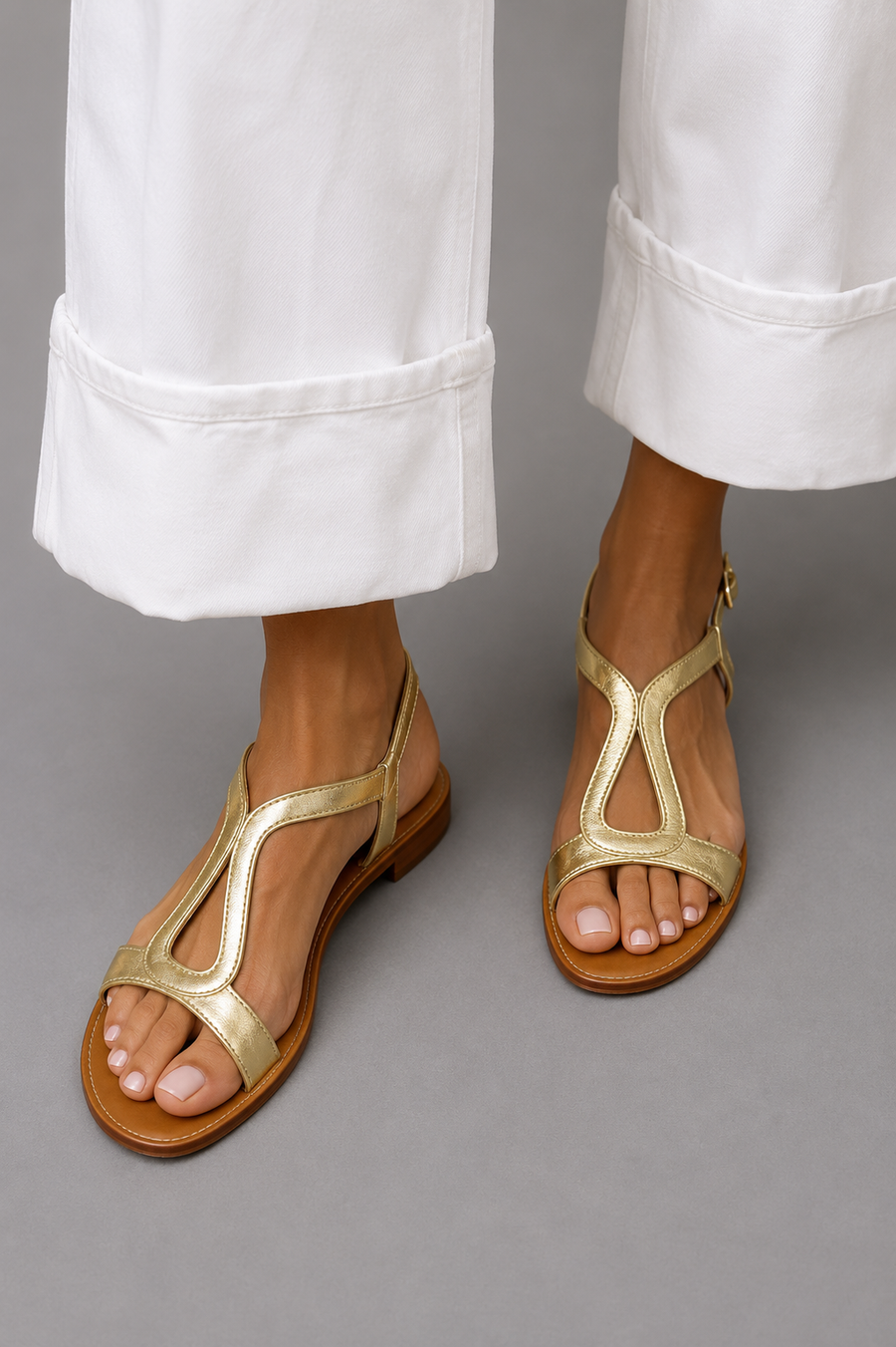 Golden thong summer sandals with ankle strap and cutout strap over toes