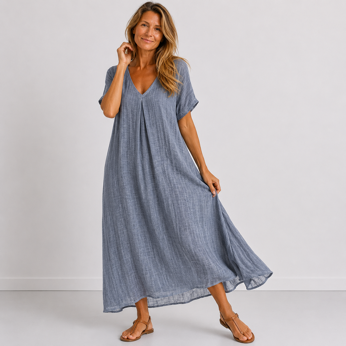 Blue V-neck midi dress with short sleeves, loose A-line silhouette and soft drape
