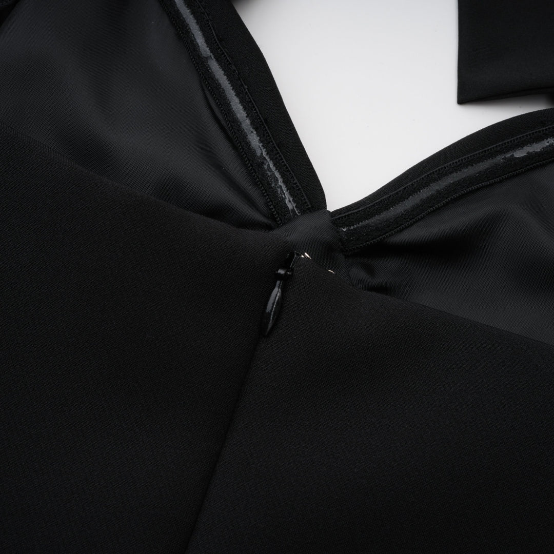 Black dress back closure with small hook-and-eye