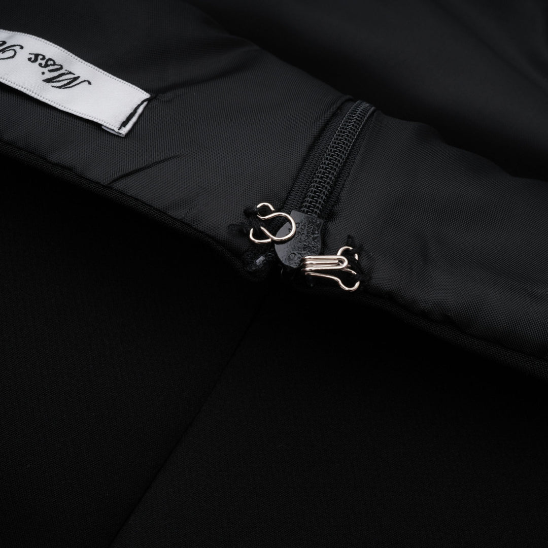 Black dress zipper with metal hook detail