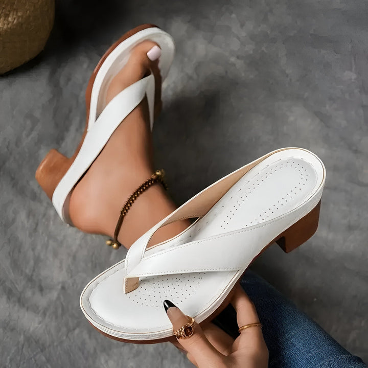 Women’s high-heeled mule sandals in white with crisscross strap and block heel