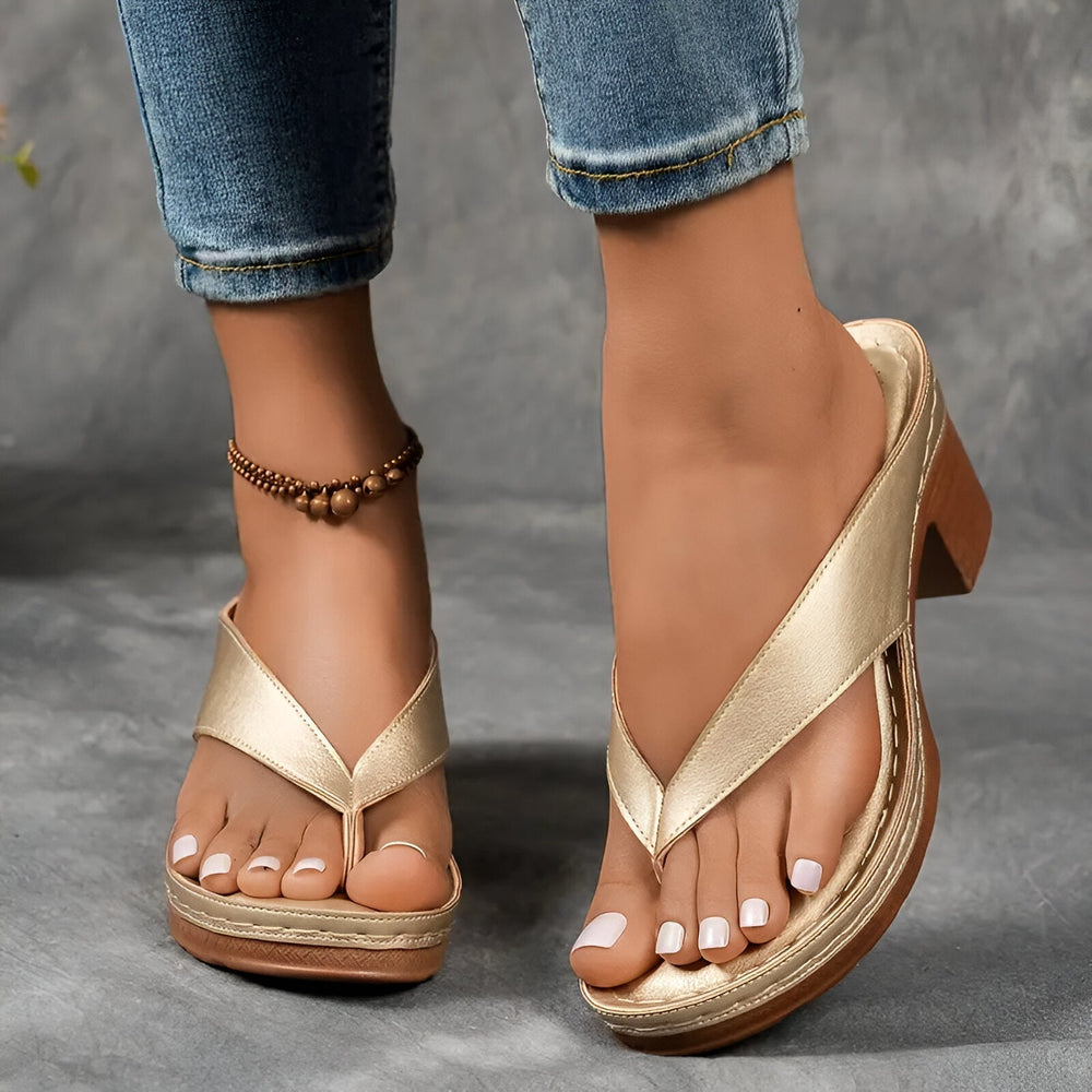 Women’s high-heeled mule sandals in metallic gold with toe-braided ankle strap and block heel
