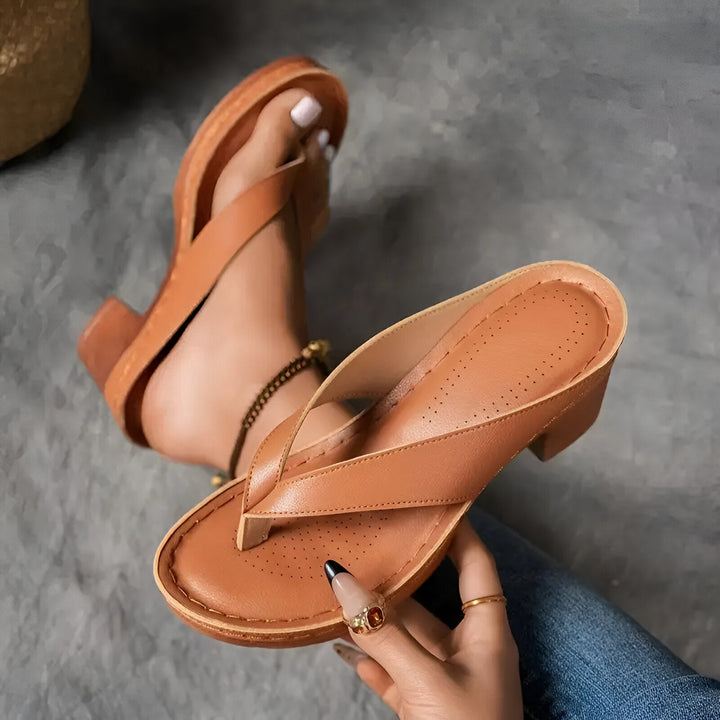 Women’s high-heeled mule sandals in tan brown with crisscross front strap and medium heel