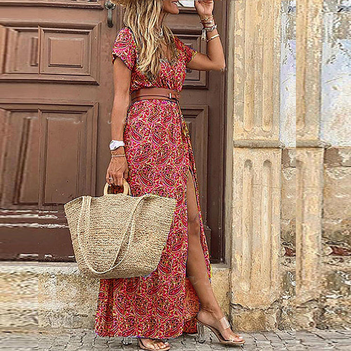 Red patterned bohemian maxi dress with short sleeves, waist belt, and side slit