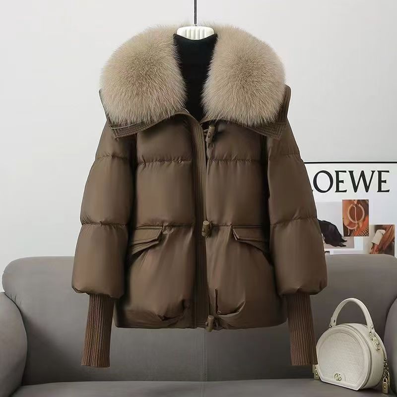 Brown puffer jacket with faux fur collar, zip front, flap pockets, ribbed knit cuffs