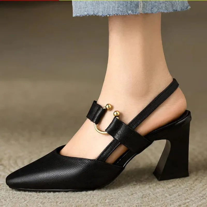Black leather look heeled slingback with ankle strap and gold buckle detail