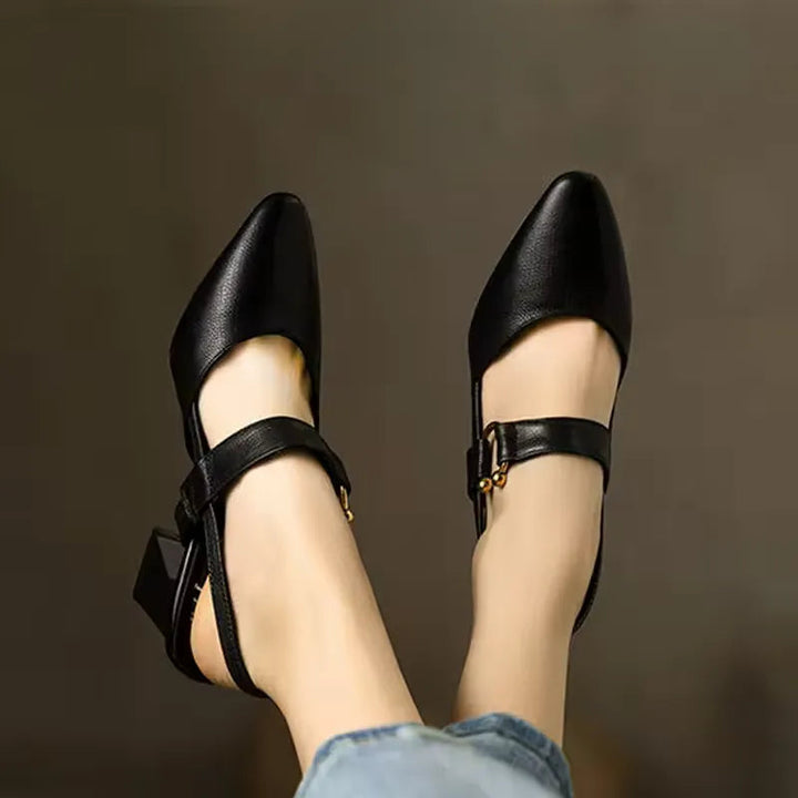 Black leather look pointed toe heeled slingback with ankle strap and gold buckle
