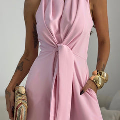 Pink halter cowl-neck jumpsuit with waist tie and draped front detail