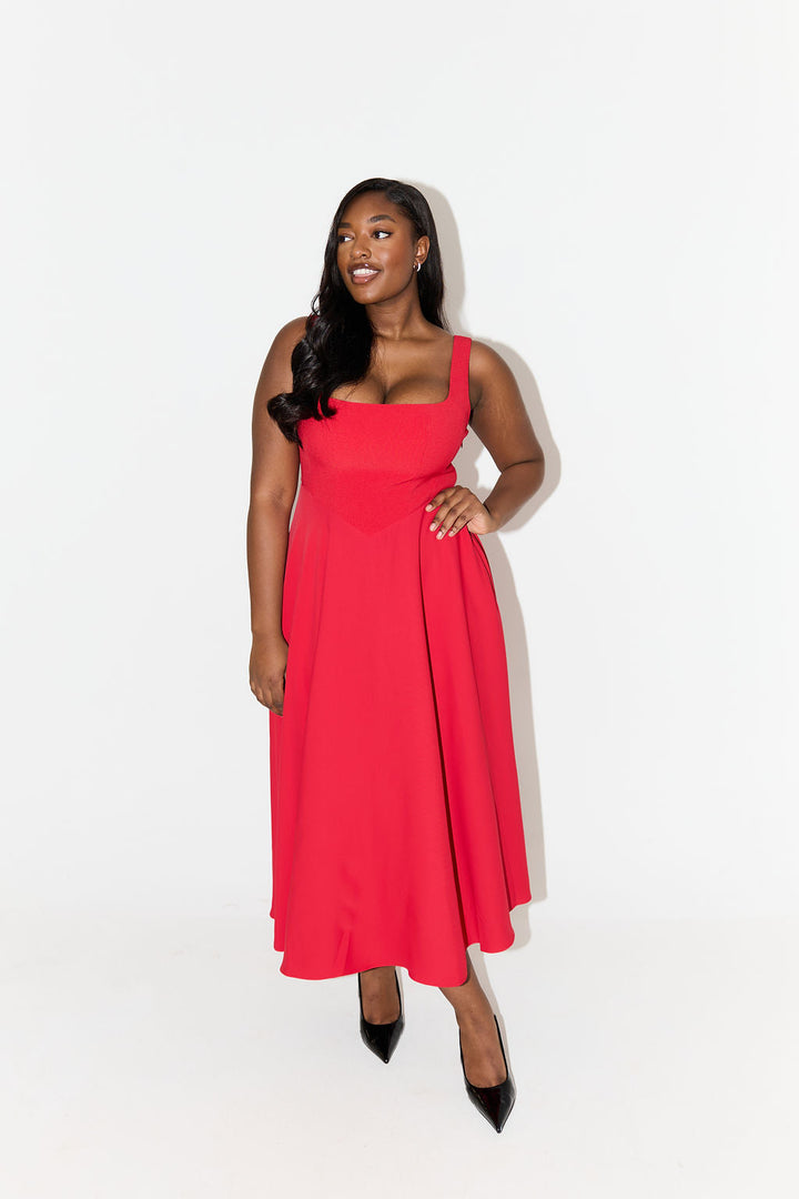 Red midi flow dress with square neckline, sleeveless bodice, and A-line hem