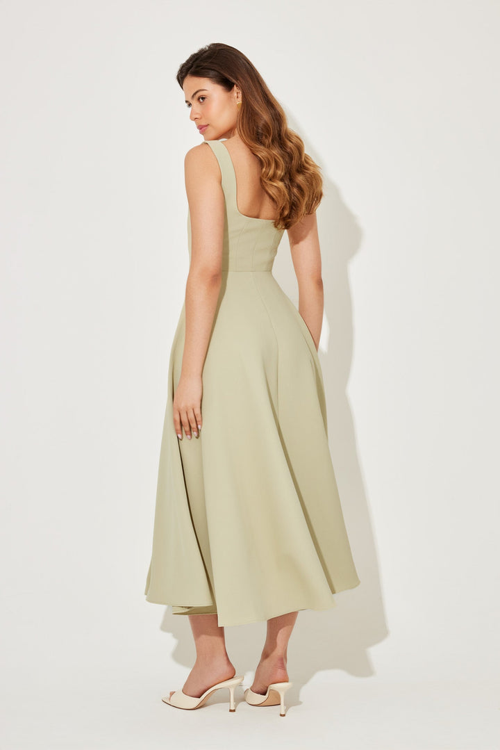 Sage green sleeveless midi flow dress with square neckline and flared skirt
