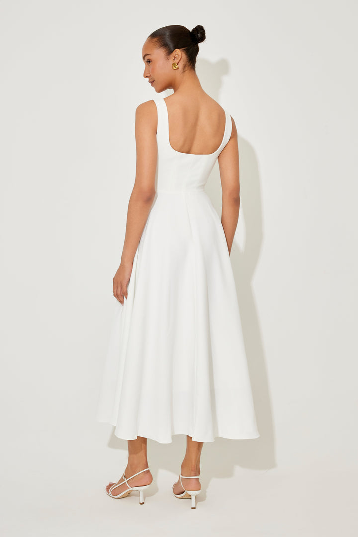 White midi flow dress with square neckline, fitted bodice, and sleeveless A-line skirt