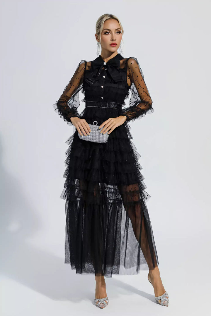 Black tiered maxi dress with sheer polka-dot sleeves, button front, and clutch