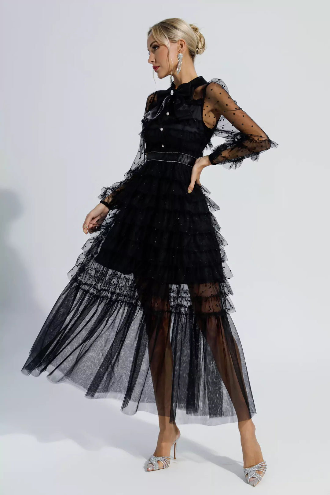 Black tiered maxi dress with sheer polka-dot sleeves and open back view, belted waist