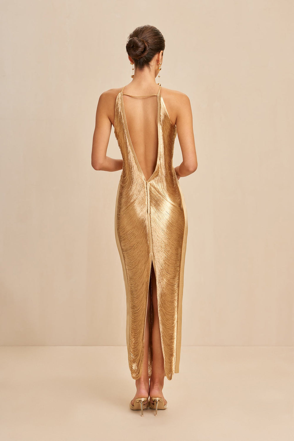 Gold halter day dress, open back with long slit and fringe-style tassels