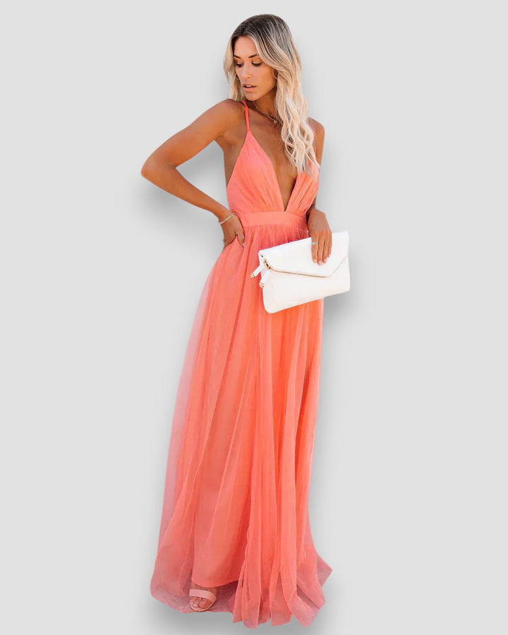 Peach halter maxi dress with deep V neckline, gathered waist, sleeveless tulle skirt