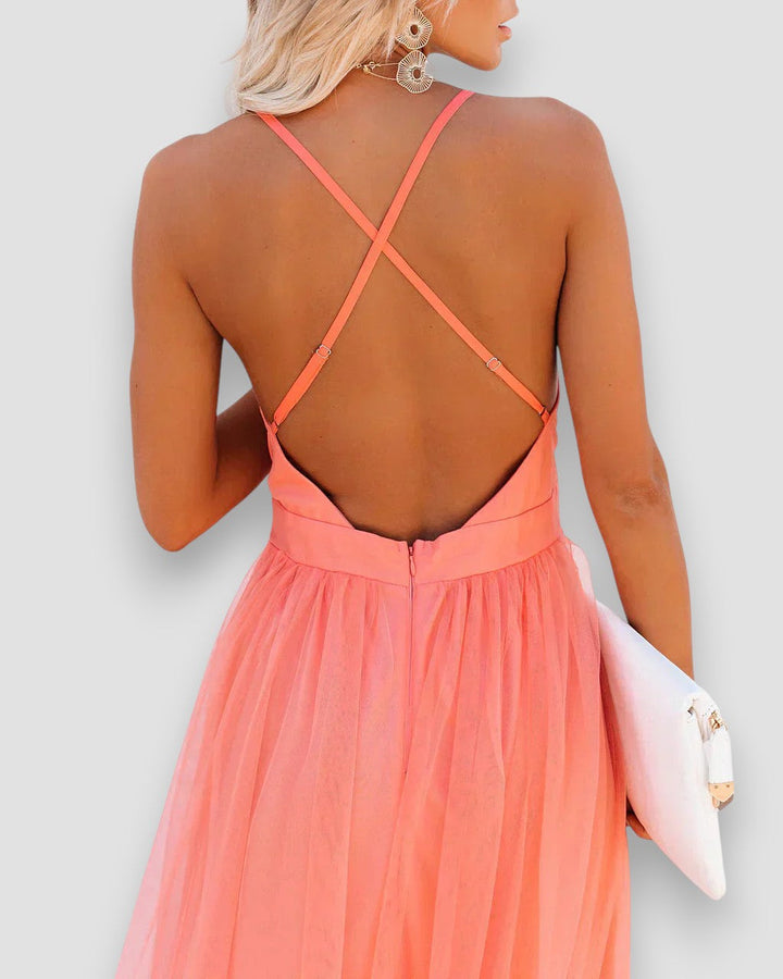 Peach halter maxi dress, open-back crisscross straps and gathered waist