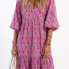 Purple patterned midi dress close-up: V-neck, gathered waist, puff sleeves