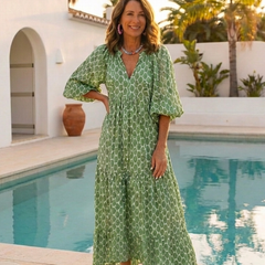Green patterned midi dress with V-neck and three-quarter puff sleeves, ankle length
