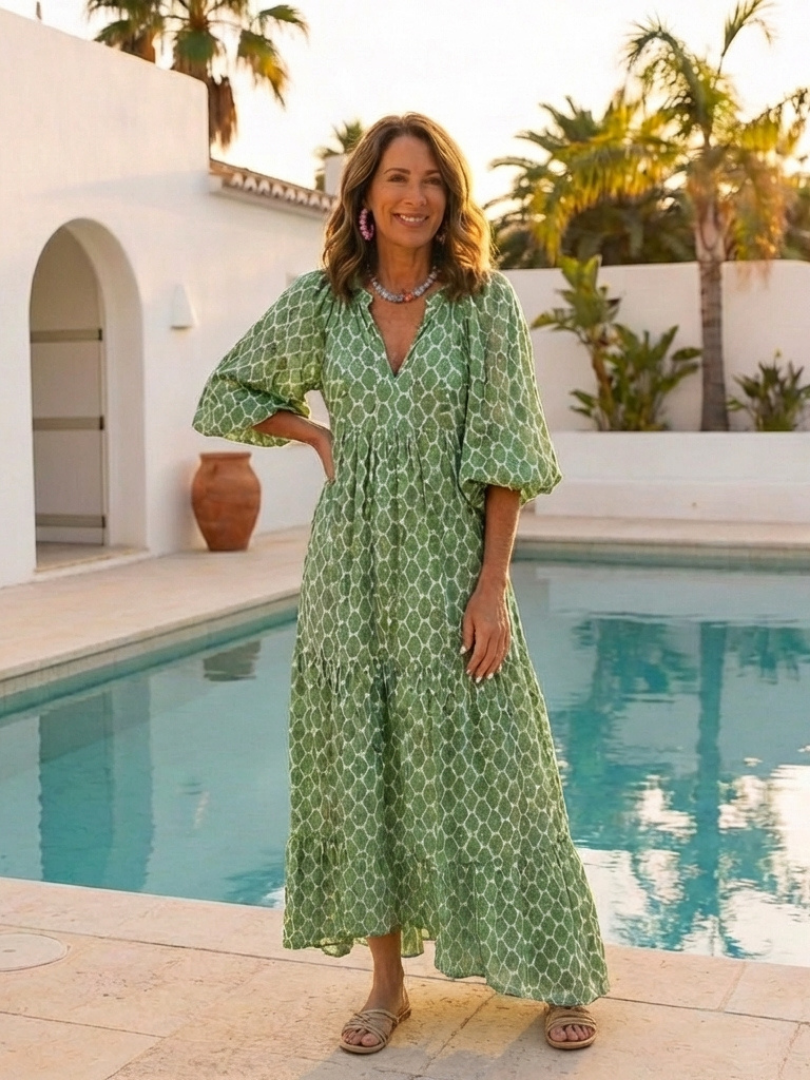 Green patterned midi dress with V-neck and three-quarter puff sleeves, ankle length