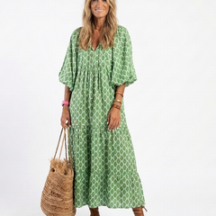 Green patterned midi dress with V-neck and three-quarter puff sleeves