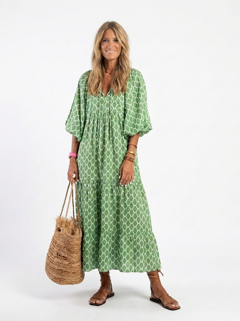 Green patterned midi dress with V-neck and three-quarter puff sleeves