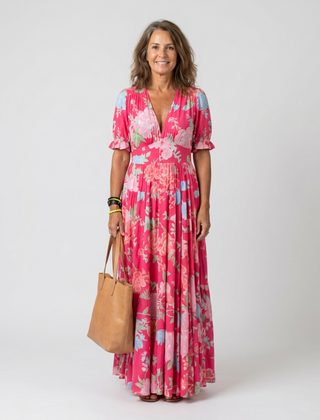 Pink floral midi dress with V-neck, short sleeves, tiered flowy skirt