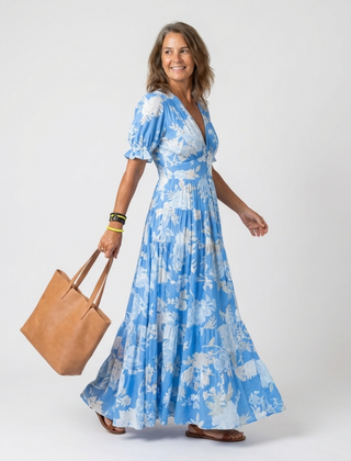 Blue floral midi dress with V-neck, short puff sleeves, elasticized waist, tiered skirt