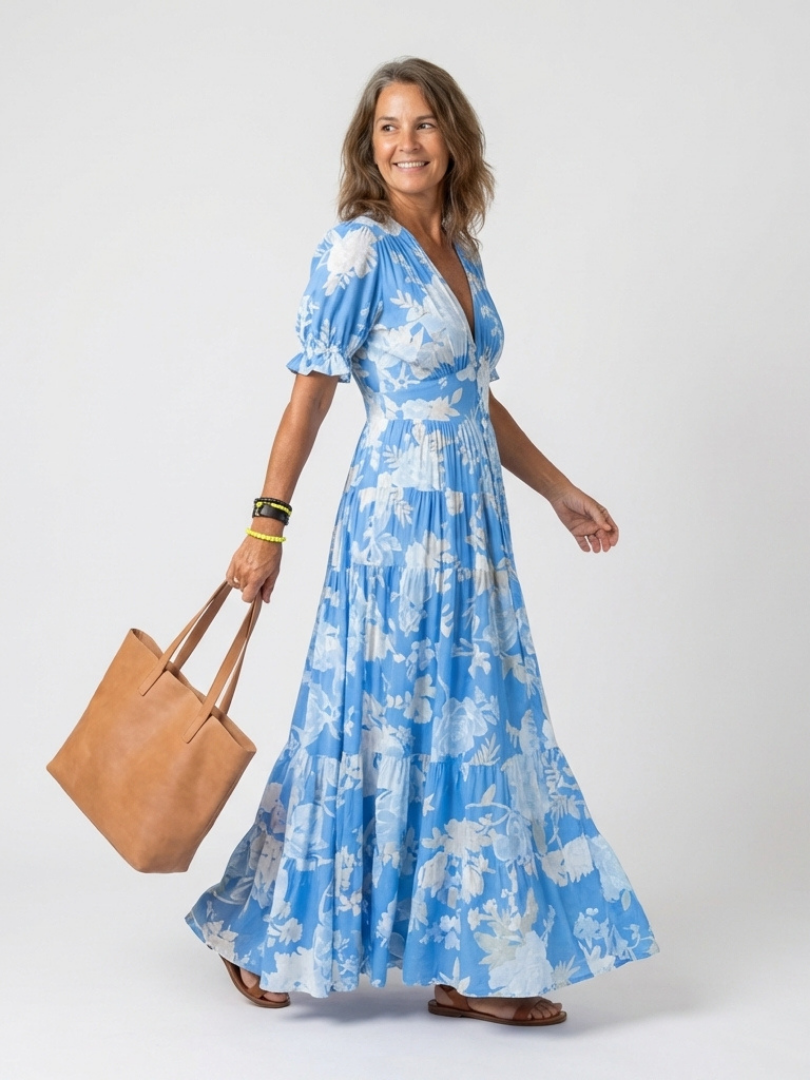 Blue floral midi dress with V-neck, short puff sleeves, elasticized waist, tiered skirt