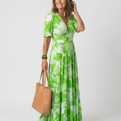 Green floral midi dress with V-neck, short puff sleeves, elastic waist, tiered skirt