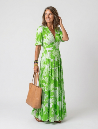 Green floral midi dress with V-neck, short puff sleeves, elastic waist, tiered skirt