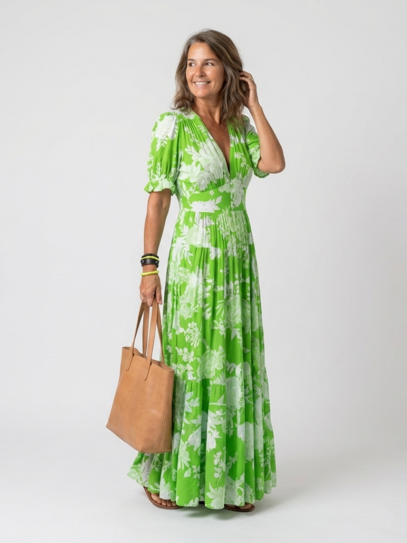 Green floral midi dress with V-neck, short puff sleeves, elastic waist, tiered skirt