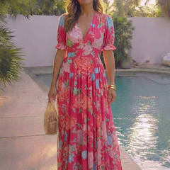 Pink floral midi dress with V-neck, short puff sleeves, layered tiered skirt