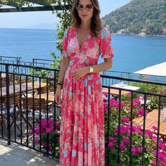 Pink floral midi dress with V-neck and short sleeves, tiered skirt