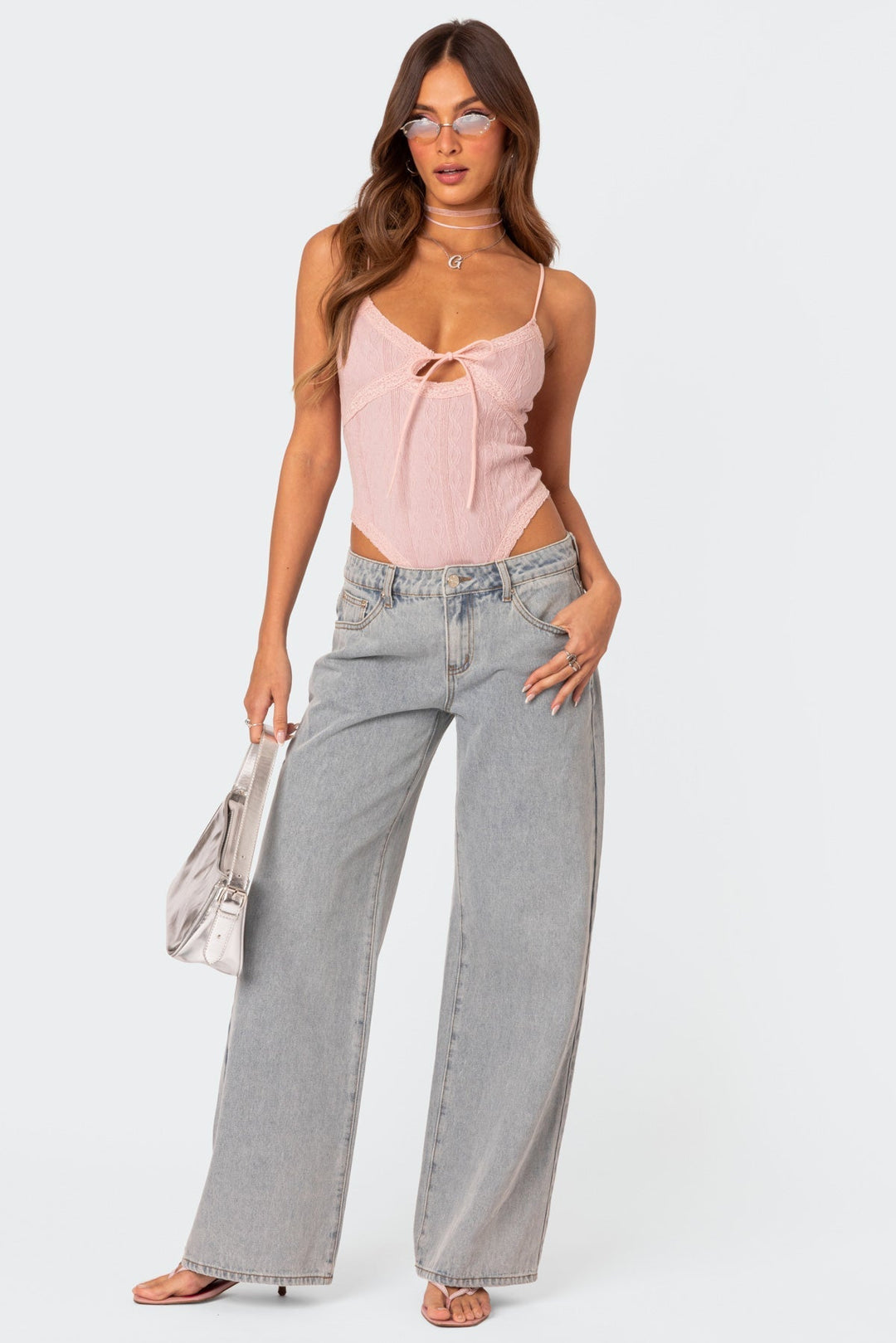 Light gray wide-leg jeans with pink bow embroidery on front pockets