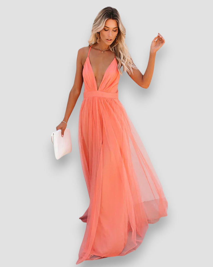 Peach halter maxi dress with V neckline and flowing layered tulle skirt