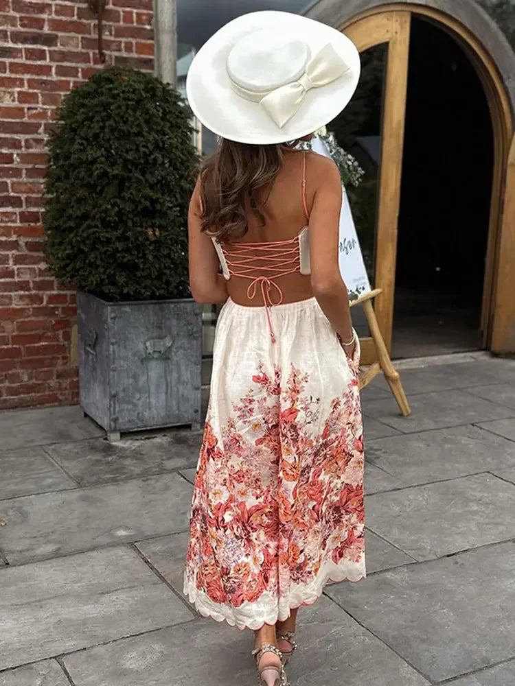Red floral halter dress with white backless bodice and gathered skirt