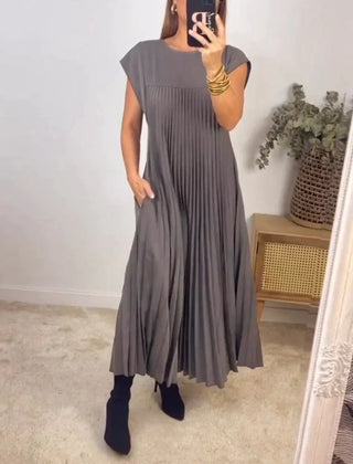 Gray sleeveless pleated maxi dress with crew neck and soft draped pleats