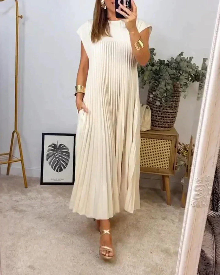 Beige sleeveless pleated maxi dress, crew neck and gathered skirt