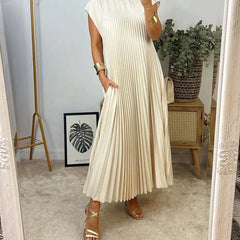 Cream sleeveless pleated maxi dress with round neckline and gathered pleat panels.